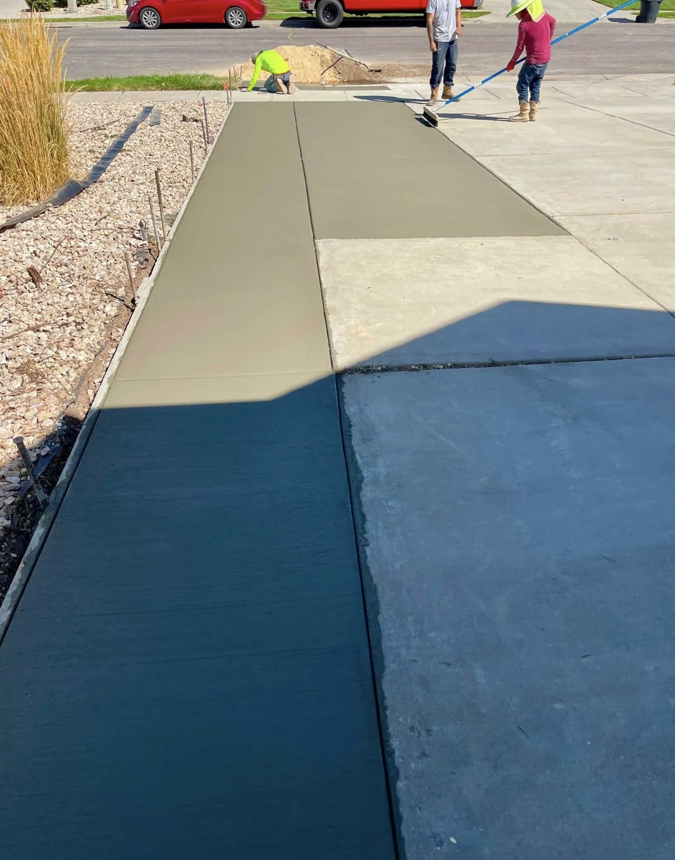 Precision Concrete crew working on fresh concrete